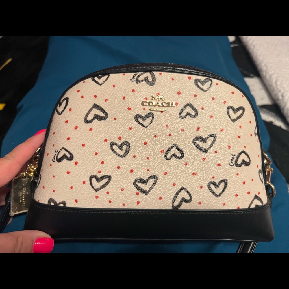 Lightly used Coach purse with adjustable strap